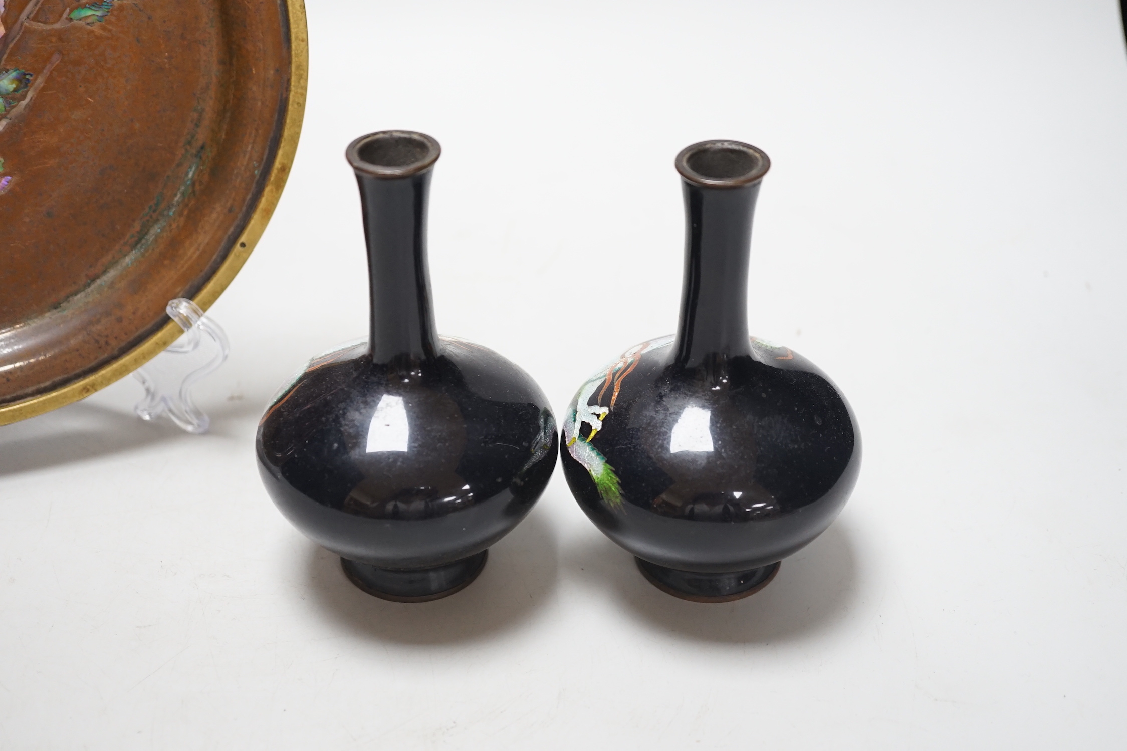 A Japanese bronze abalone inlaid dish and a pair of Japanese cloisonné vases enamelled with dragons, the dish 21cm in diameter